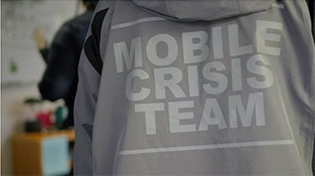 A gray parka with "Mobile Crisis Team" stamped on the back.